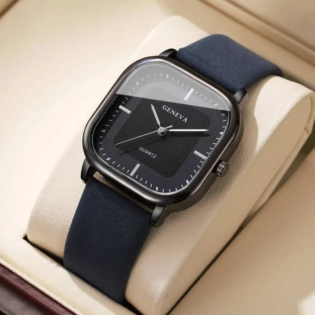 Geneva watch with navy blue strap on a beige cushion